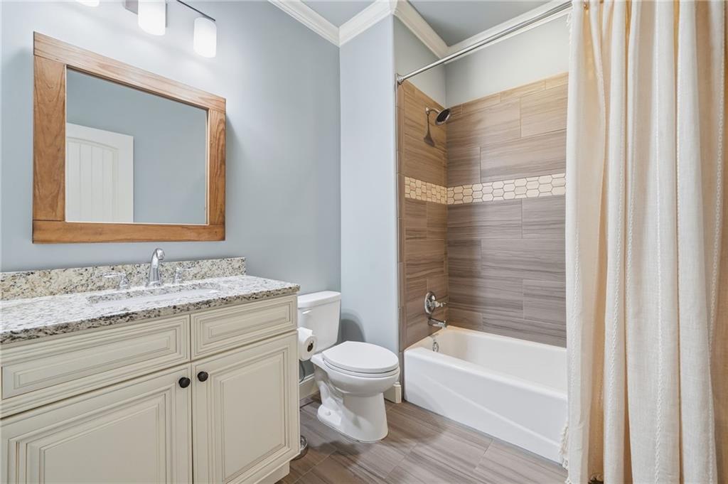 262 Trecastle Square Canton, GA 30114 - Photo 33 of 46 a bathroom with a granite countertop sink toilet and shower