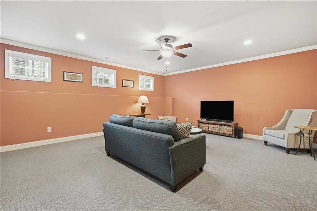 262 Trecastle Square Canton, GA 30114 - Photo 34 of 46 a living room with furniture and a flat screen tv