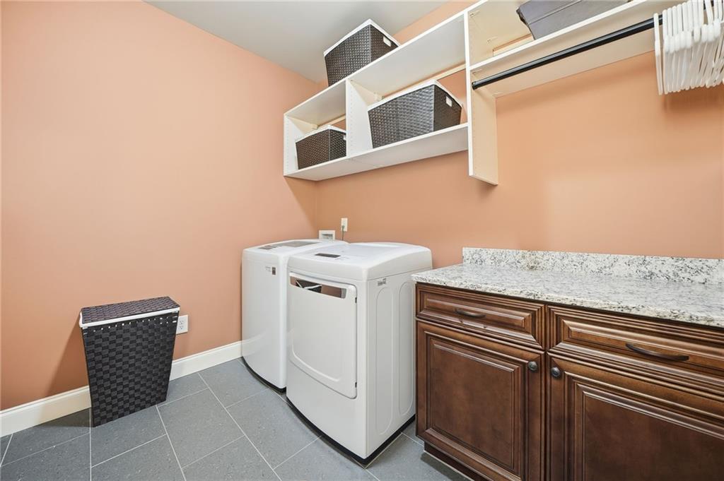 262 Trecastle Square Canton, GA 30114 - Photo 35 of 46 a utility room with dryer and washer