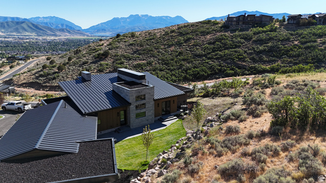 1918 Chimney Rock Road Heber City, UT 84032 - Photo 10 of 74 Modern architectural residence featuring a dark metal standing seam roof and wood-look siding