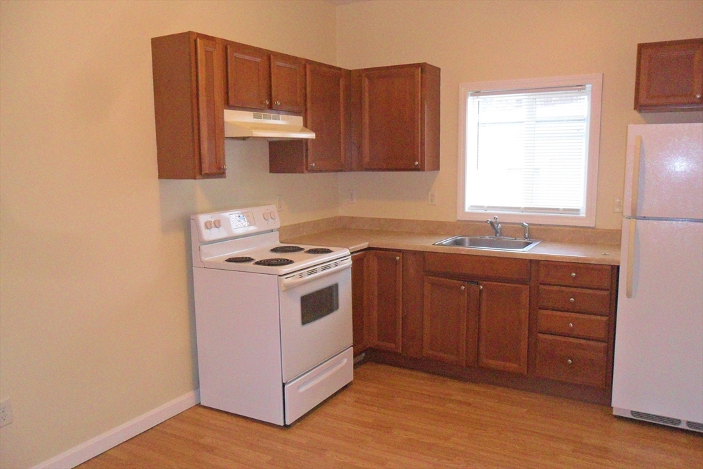 a kitchen with a stove and a sink