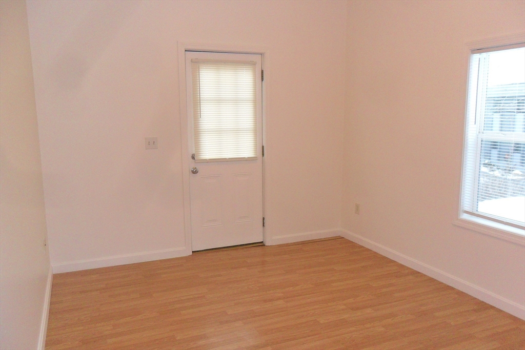848 Waverly Street, Unit 3 Framingham, MA 01702 - Photo 4 of 8 an empty room with a window