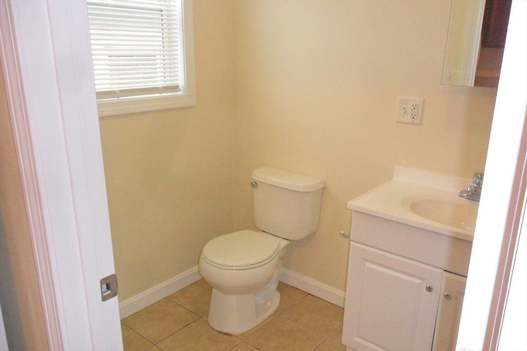 848 Waverly Street, Unit 3 Framingham, MA 01702 - Photo 6 of 8 a bathroom with a toilet and a sink