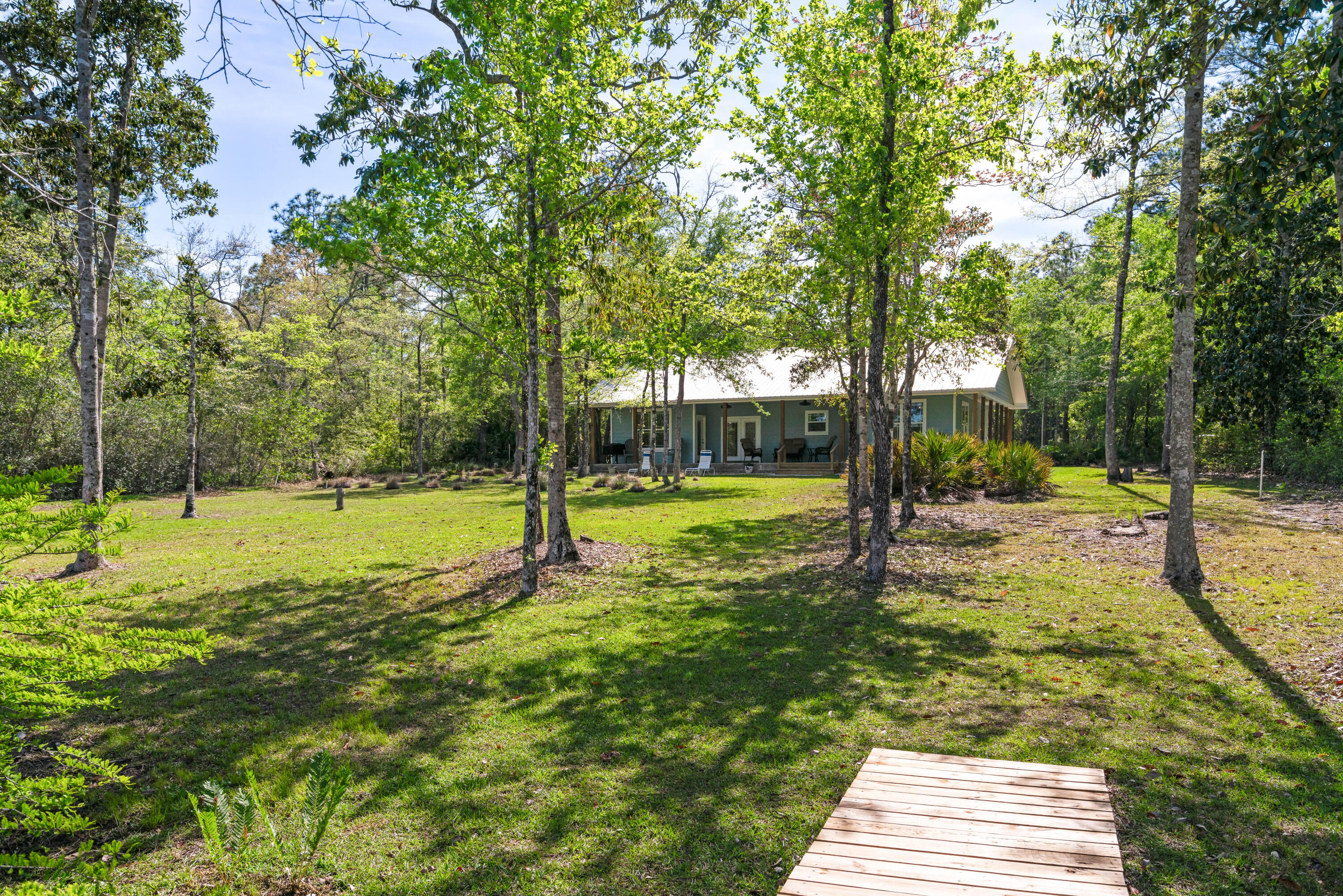 528 Bay Grove Road Freeport, FL 32439 - Photo 47 of 68 a view of a yard with swimming pool