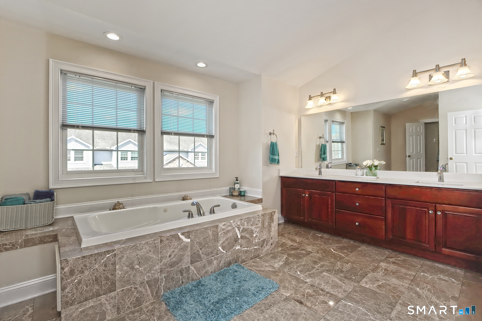 102 Lantern Court, Unit 102 Clinton, CT 06413 - Photo 24 of 36 a spacious bathroom with double vanity and a bathtub