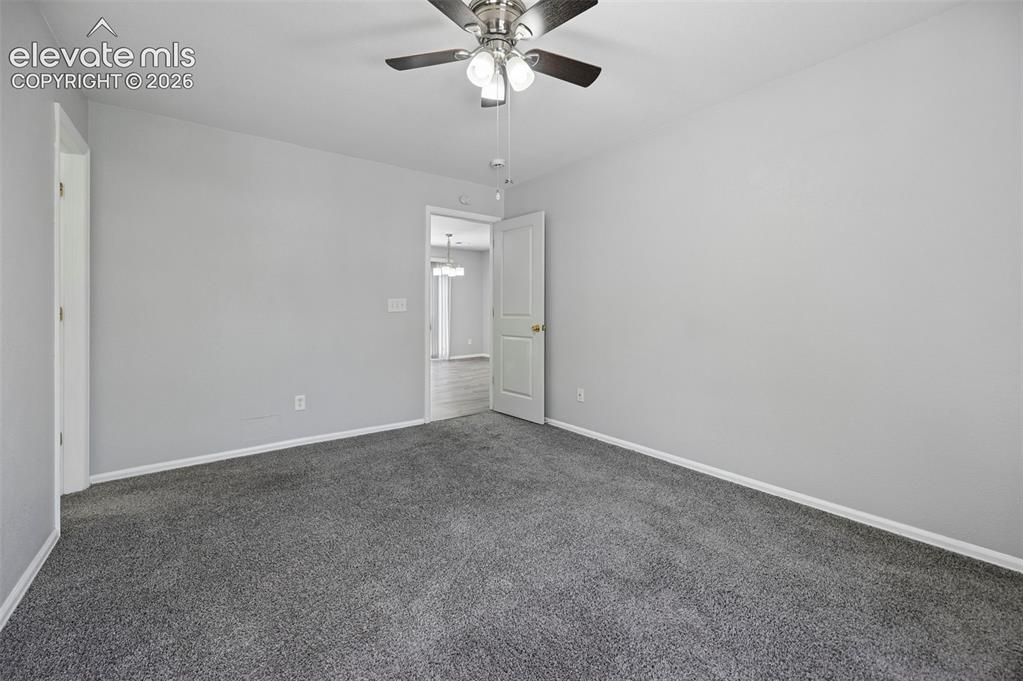 431 Kitfield View Colorado Springs, CO 80916 - Photo 19 of 27 a view of an empty room with a window