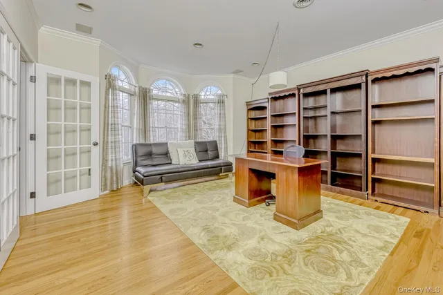 a living room with hard wood flooring and furniture