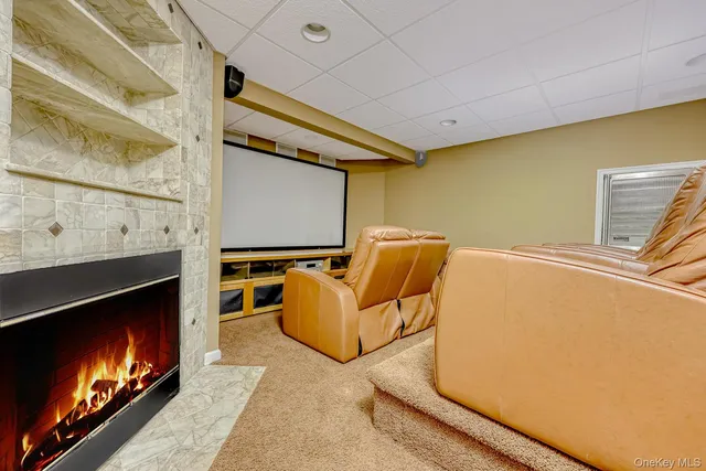 a living room with furniture flat screen tv and a fireplace