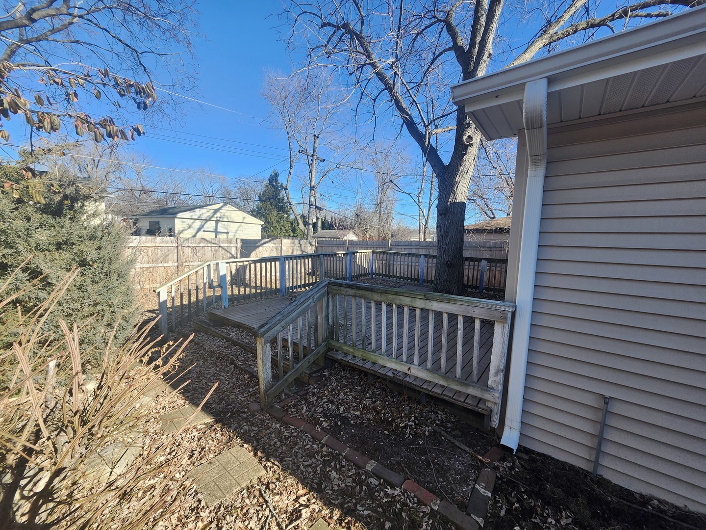 110 Cedar Circle Streamwood, IL 60107 - Photo 3 of 14 a view of a house with backyard and wooden fence
