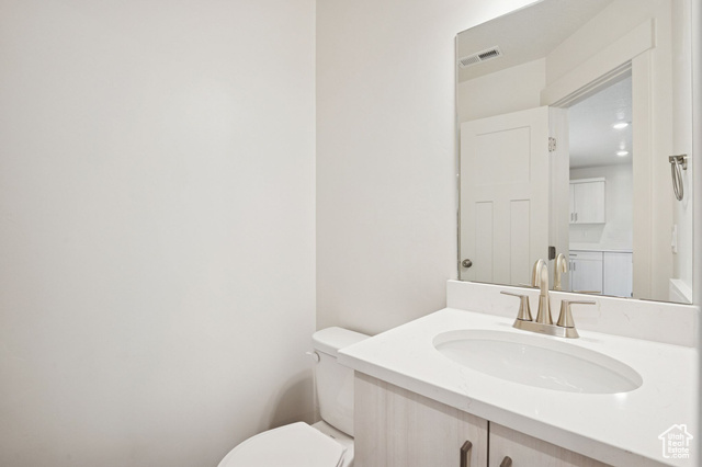 1615 North Angel Street, Unit F Layton, UT 84041 - Photo 7 of 45 Half bathroom featuring vanity and toilet