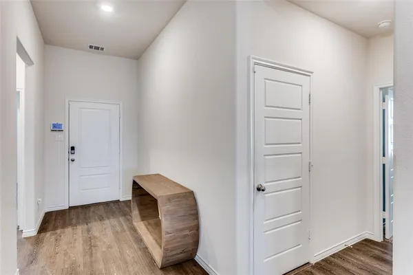 a view of bedroom with a furniture and wooden floor