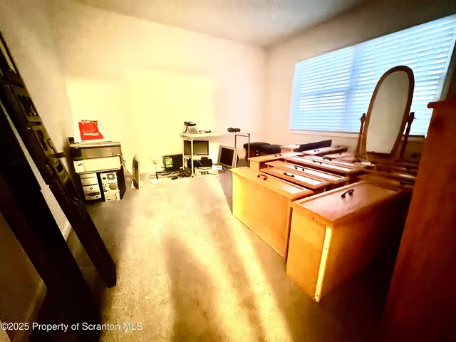 a view of a swimming pool with furniture