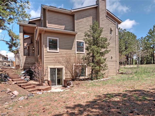 735 Winding Hills Road Monument, CO 80132 - Photo 39 of 42 Walk way from the front door leads down to the side walk out