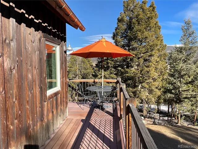 a view of balcony with wooden floor and outdoor space