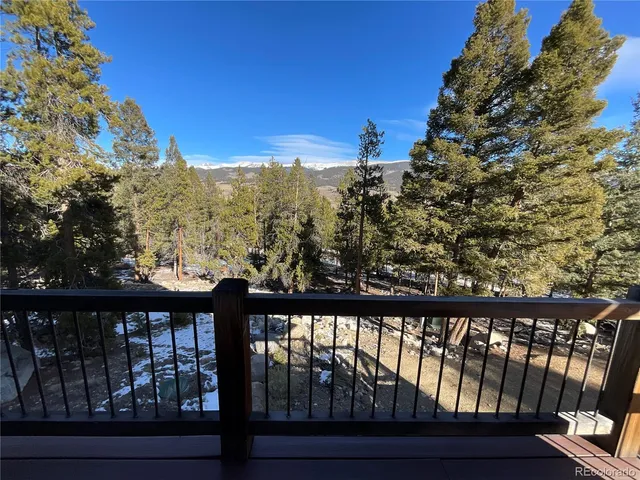 a view of a house with a tree