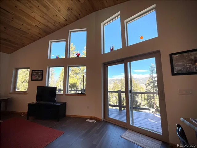 a living room with furniture and windows