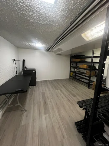 a view of a livingroom with furniture and wooden floor