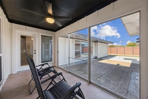 a patio with table and chairs