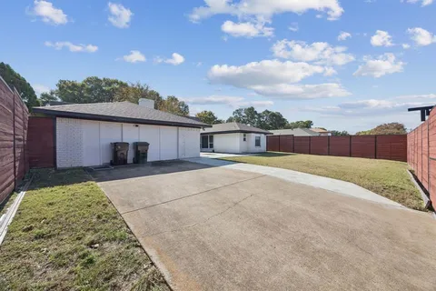 a house view with a garden space