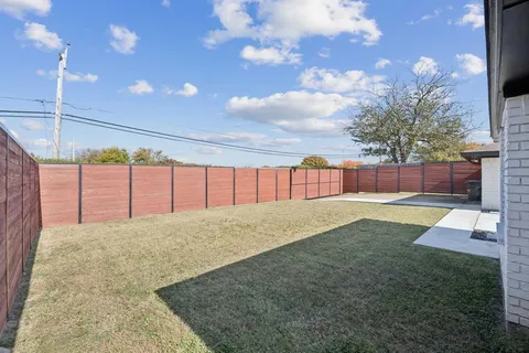 a view of a back yard of the house