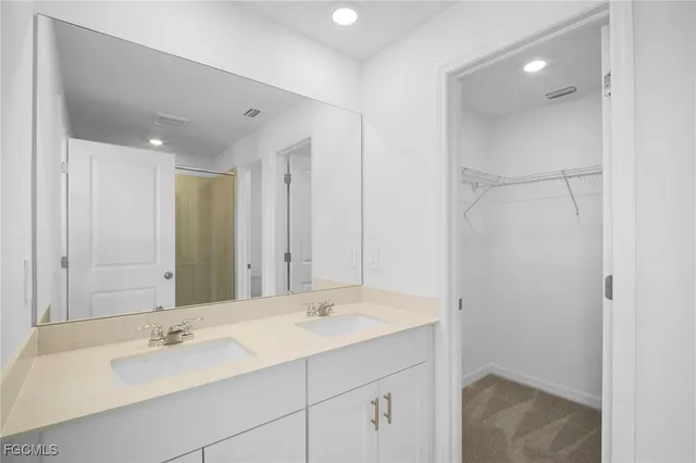 a bathroom with a glass shower door