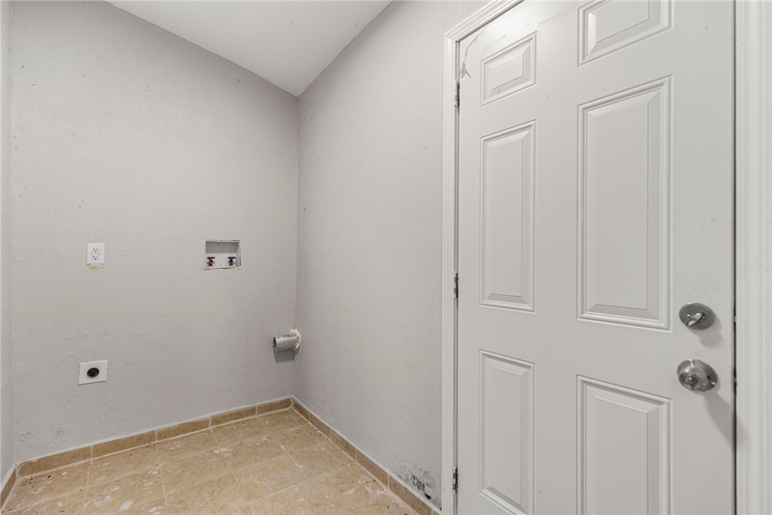 109 Farmer Street Anderson, SC 29621 - Photo 20 of 31 Ready for appliances, this utility room awaits your custom setup, featuring a durable tile floor.