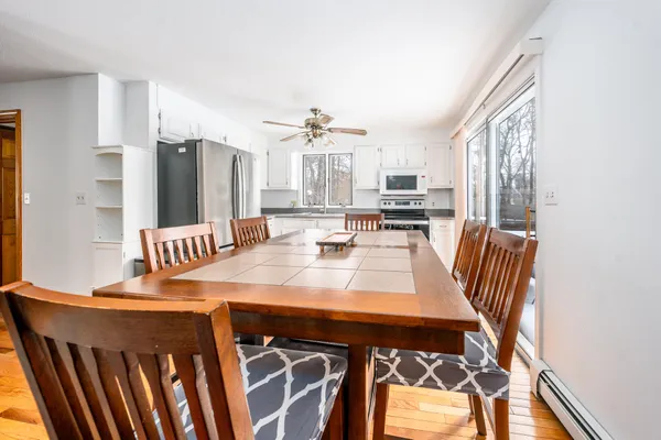 a view of kitchen and dining area with furniture