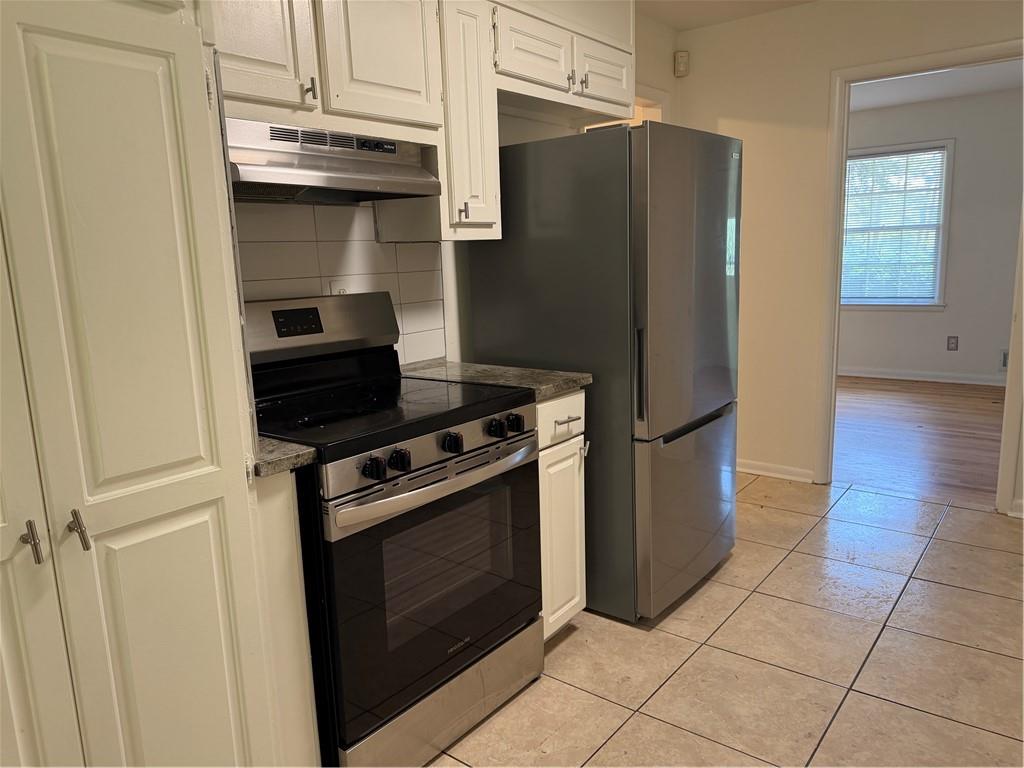 3460 Boring Road Decatur, GA 30034 - Photo 2 of 16 a kitchen with a stove top oven and cabinets