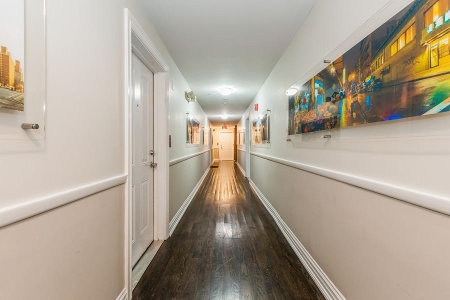 125 43rd Street, Unit 604 Union City, NJ 07087 - Photo 16 of 17 a view of a hallway with wooden floor