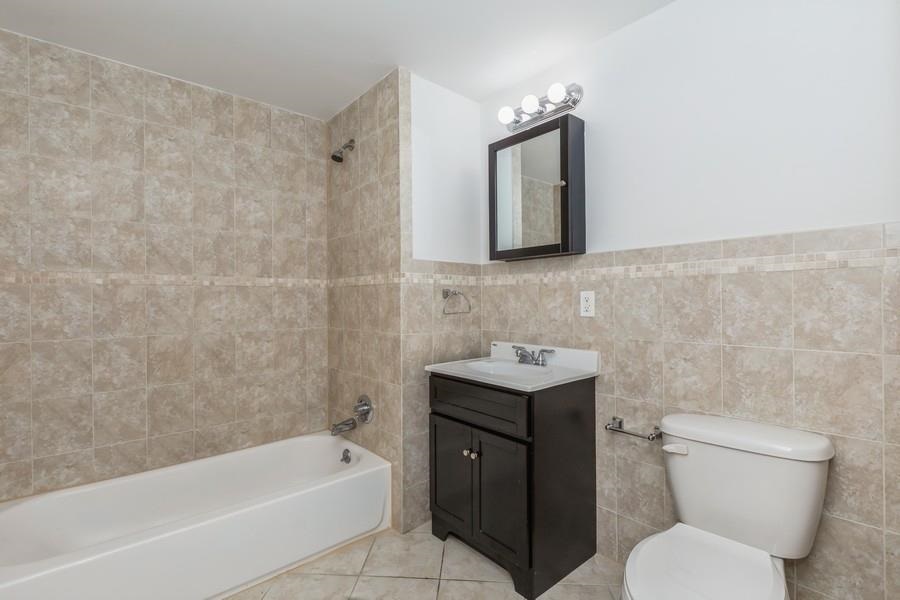 125 43rd Street, Unit 604 Union City, NJ 07087 - Photo 5 of 17 a bathroom with a toilet sink and bathtub