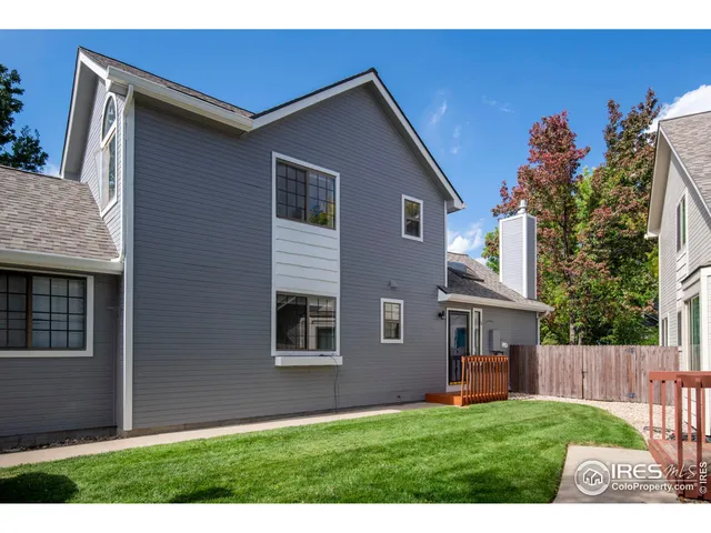 a view of house with backyard
