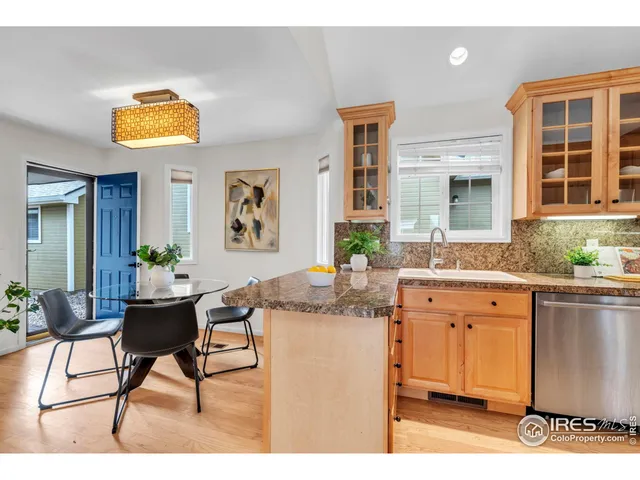 a living room with granite countertop furniture and a potted plant