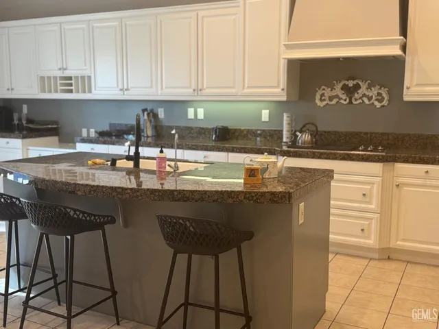 a kitchen with stainless steel appliances granite countertop a sink and cabinets