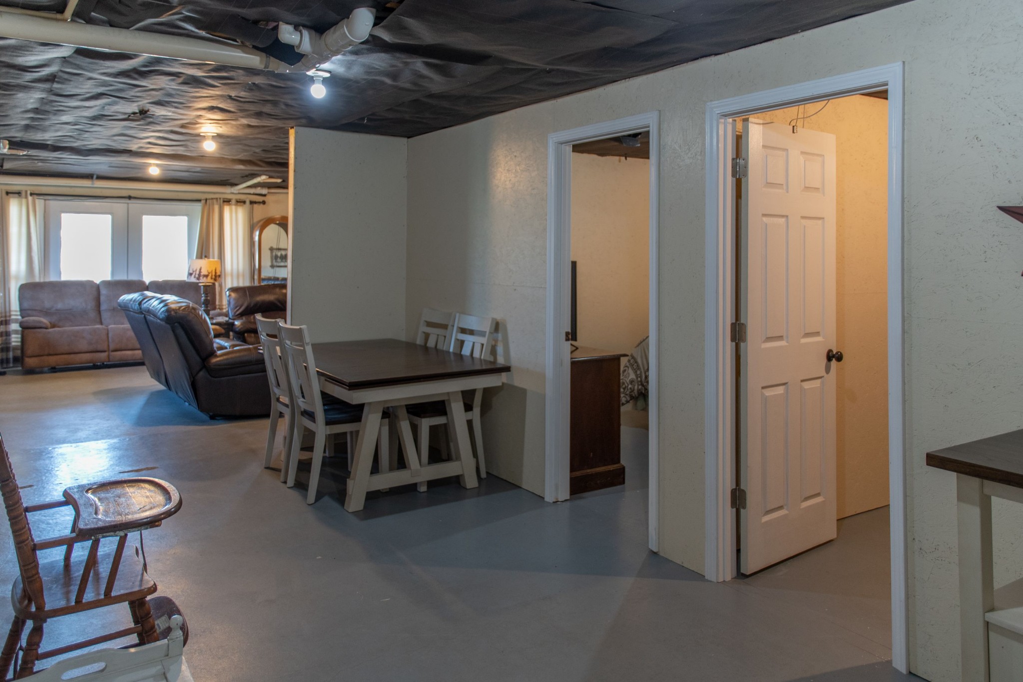 319 Wirmingham Road Monroe, TN 38573 - Photo 12 of 34 a dining room with furniture and a chandelier