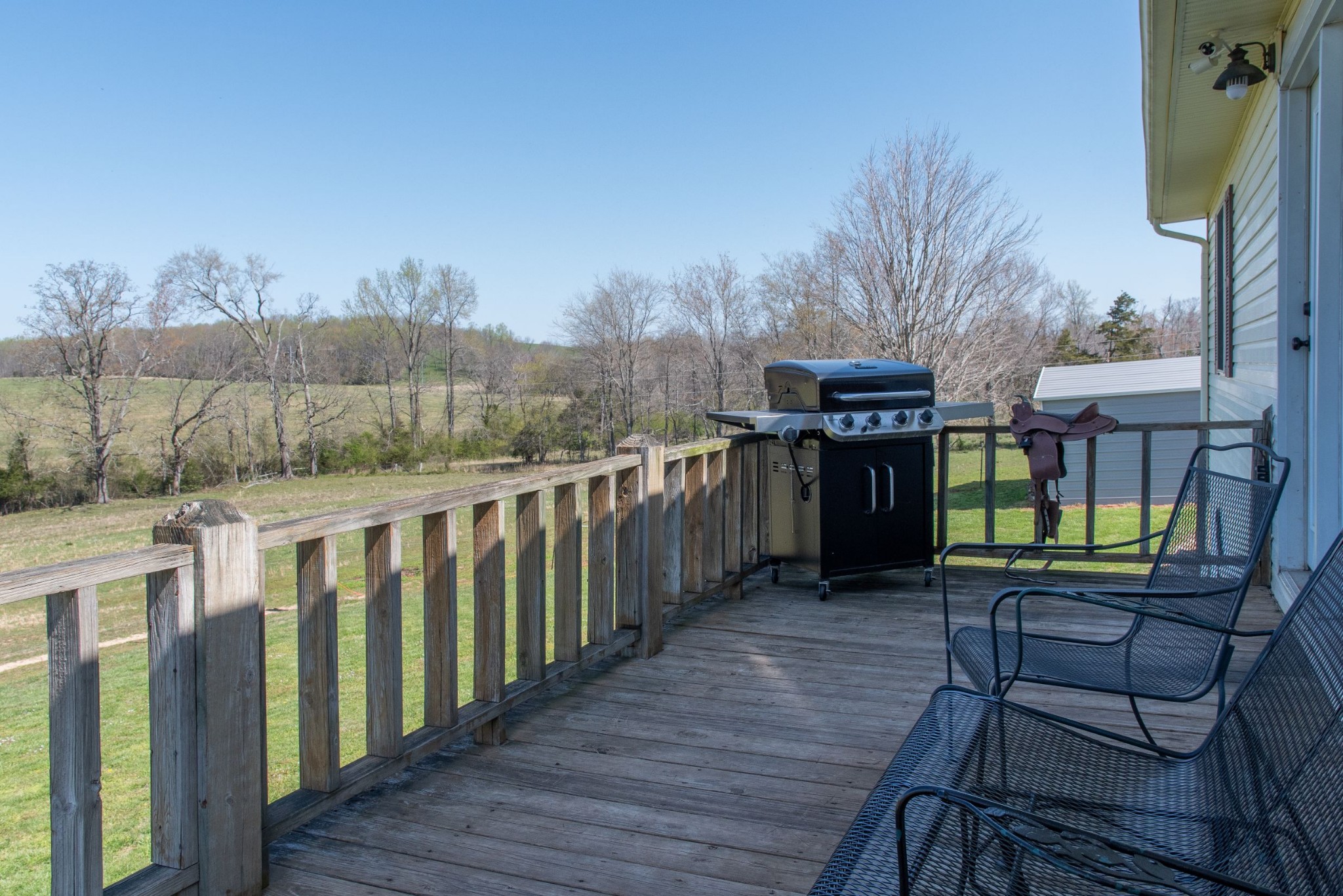 319 Wirmingham Road Monroe, TN 38573 - Photo 27 of 34 a view of a chairs and table on the wooden deck