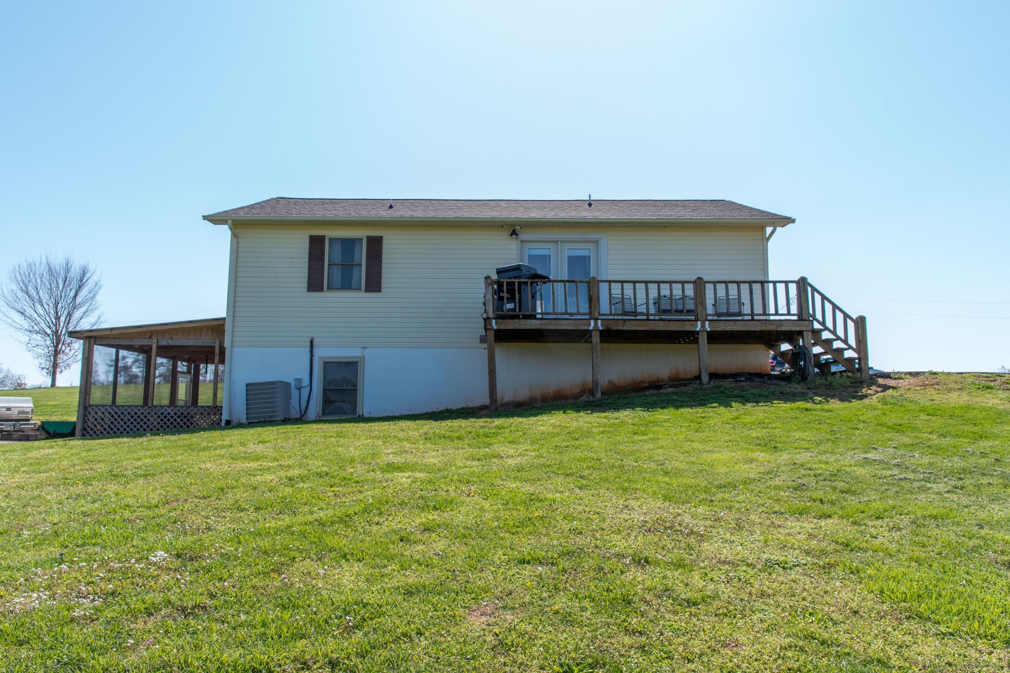 319 Wirmingham Road Monroe, TN 38573 - Photo 31 of 34 a view of a house with a yard and sitting area