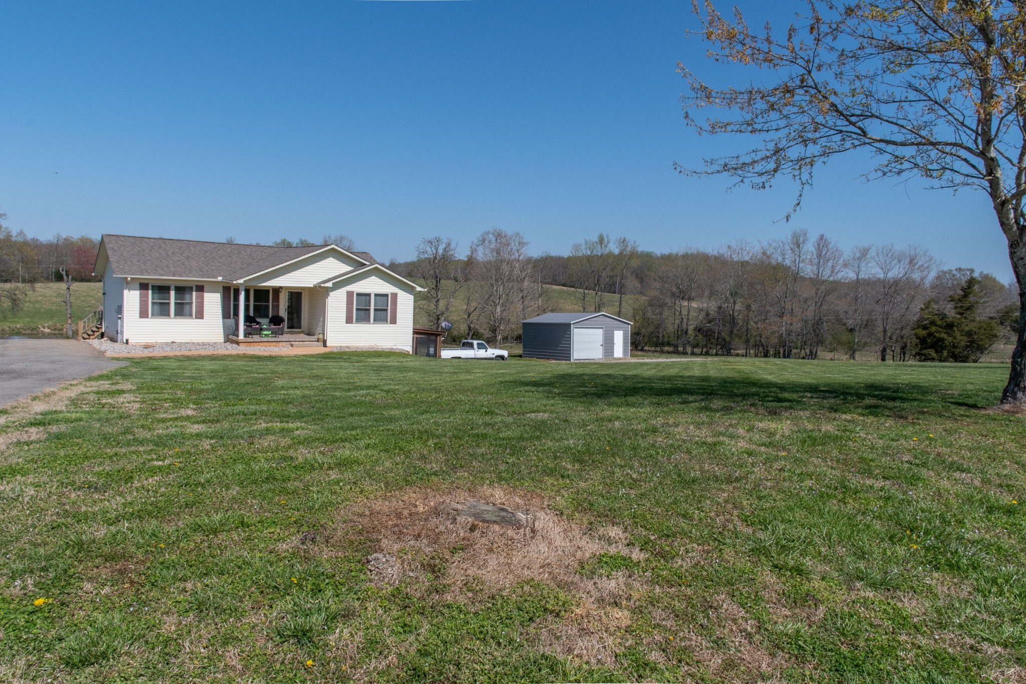 319 Wirmingham Road Monroe, TN 38573 - Photo 34 of 34 a front view of a house with a yard and trees