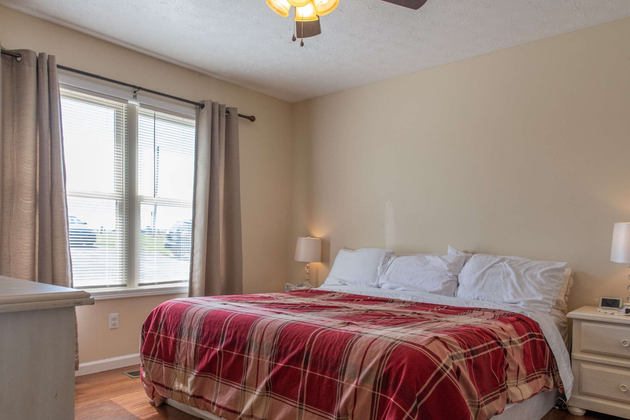 319 Wirmingham Road Monroe, TN 38573 - Photo 6 of 34 a bedroom with a bed and a lamp next to a window