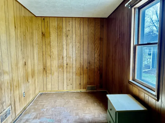 a room with a closet and mirror