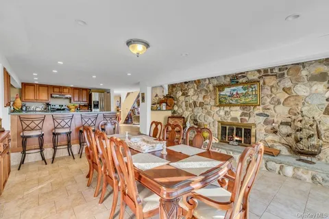 a large kitchen with lots of counter space a sink and stainless steel appliances