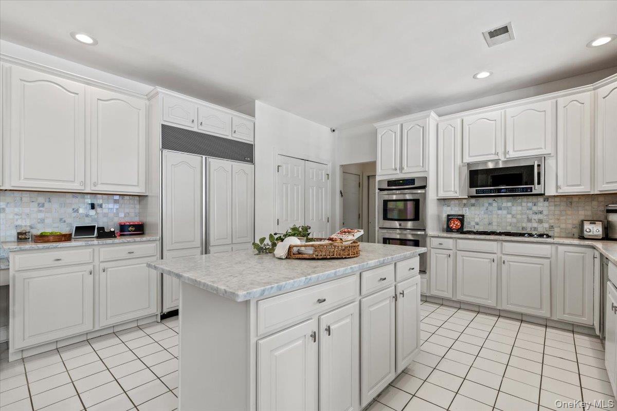 32 Rolling Ridge Road White Plains, NY 10605 - Photo 11 of 32 Sub Zero refrigerator, double ovens, Miele dishwasher , and marble countertops.