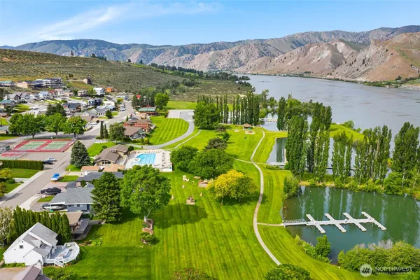 an aerial view of a house with outdoor space swimming pool