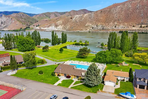 a swimming pool with trees in the background