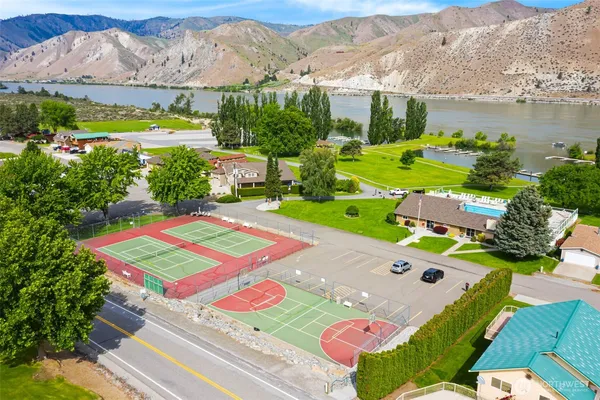 an aerial view of a house with a big yard
