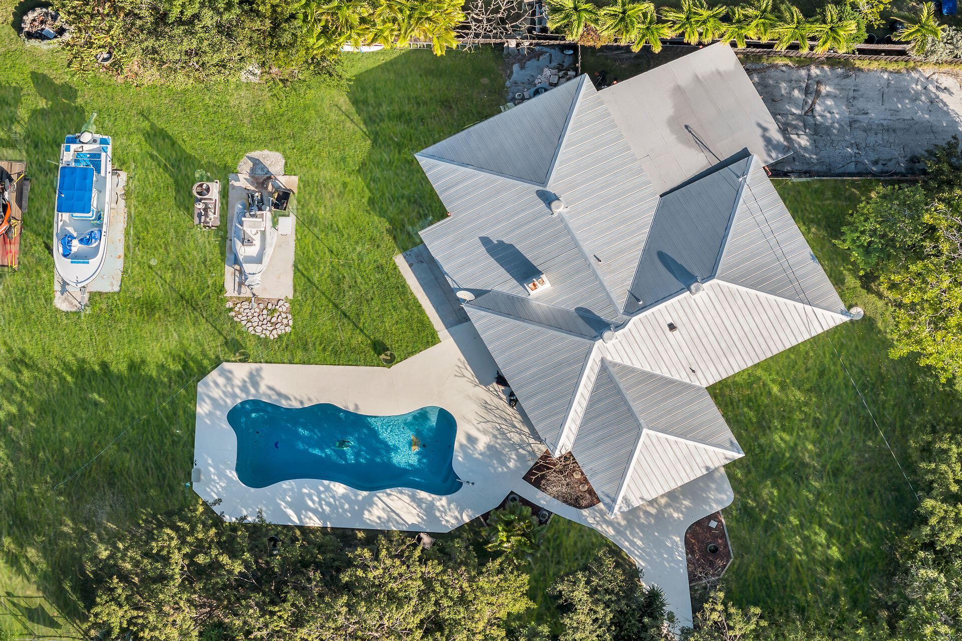 an aerial view of a house with outdoor space patio and swimming pool