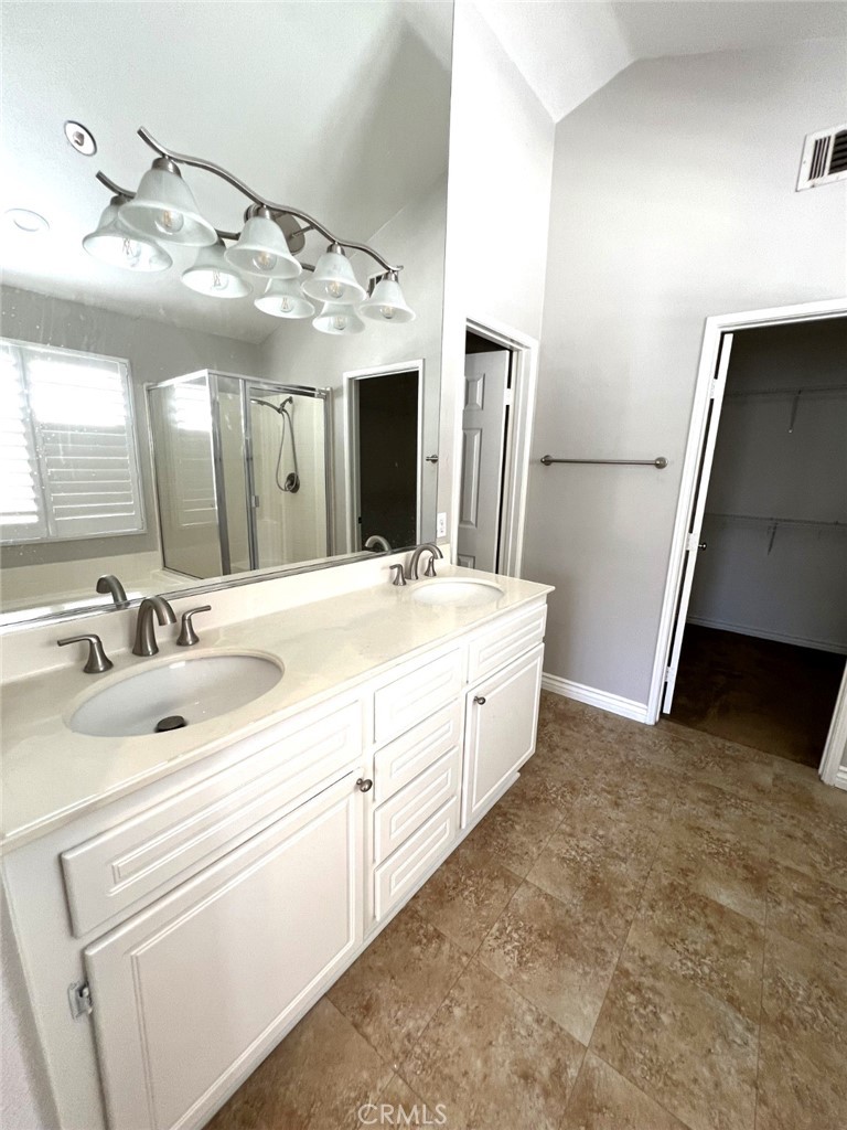 14101 Visions Drive La Mirada, CA 90638 - Photo 11 of 26 a bathroom with a double vanity sink and a mirror