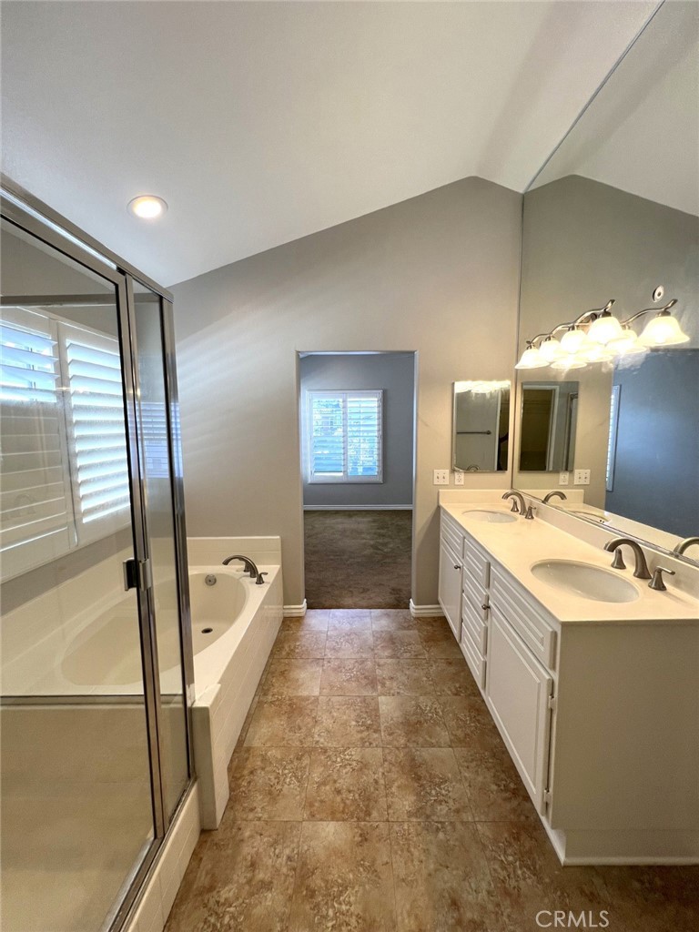 14101 Visions Drive La Mirada, CA 90638 - Photo 13 of 26 a large white kitchen with sink and washing machine