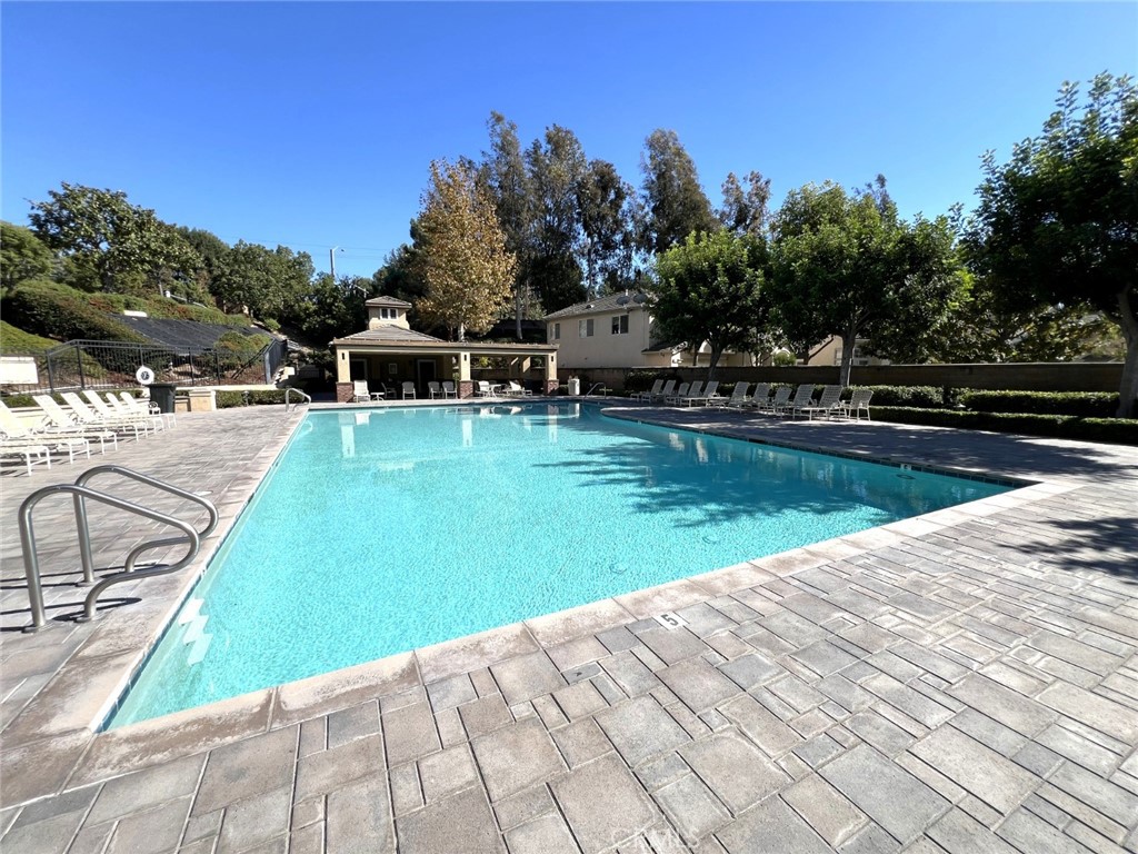 14101 Visions Drive La Mirada, CA 90638 - Photo 25 of 26 a view of a swimming pool with a yard and palm trees