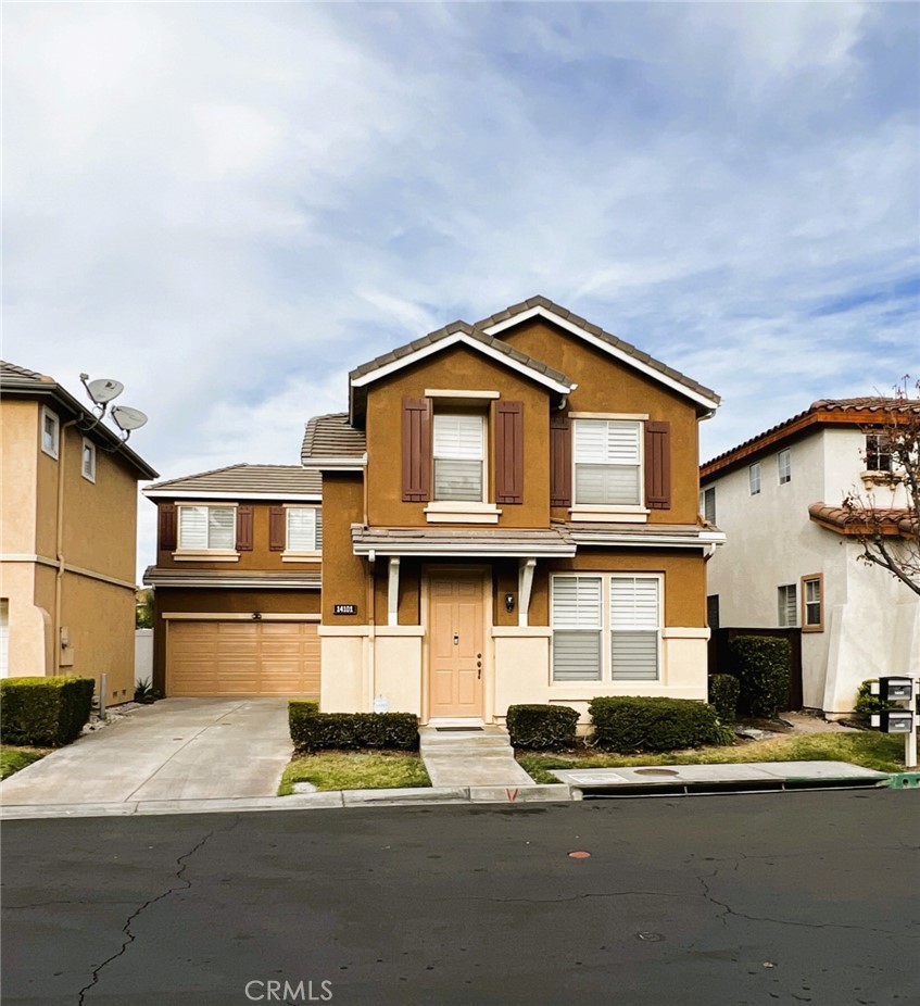 14101 Visions Drive La Mirada, CA 90638 - Photo 4 of 26 a front view of a house with a yard