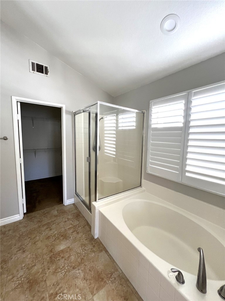 14101 Visions Drive La Mirada, CA 90638 - Photo 10 of 26 a bathroom with a bathtub and a shower